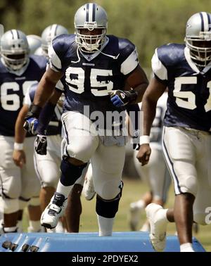 Dallas Cowboys nose tackle Jason Ferguson watches practice at football  training camp Aug. 3, 2006, in Oxnard, Calif. Ferguson - at 6-foot-3, 310  pounds - is the man in the middle of