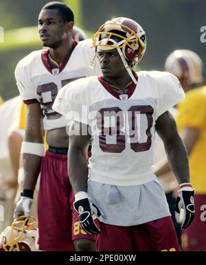 Washington Redskins head coach Steve Spurrier chats with wide receiver  Darnerien McCants in the final practice shortly before the kickoff of the  NFL preseason match American Bowl against the San Francisco 49ers