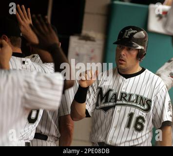 Florida Marlins' Paul Lo Duca (16) is congratulated by teammates in the  sixth inning after scoring against the Washington Nationals on Saturday,  July 30, 2005, in Miami. The Marlins defeated the Nationals