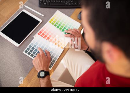 Male photo editor using graphics tablet in office Stock Photo