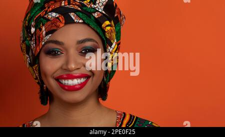 Closeup of black lady wearing african ethnic turban, copy space Stock Photo