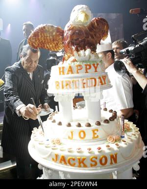 Joseph Jackson, center, father of popstar Michael Jackson, cuts