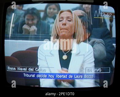 Peruvian television host Laura Bozzo, whose Laura show is a hit on the  U.S. Spanish network Telemundo, shows her passport during a news conference  in Lima, Peru, Wednesday, April 2, 2003. Bozzo