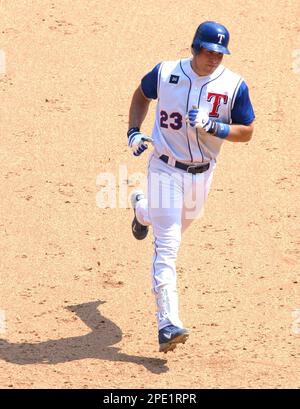 Texas Rangers Mark Teixeira runs out of the batters box after hitting a  double off of Cleveland Indians pitcher Cliff Lee that scored Alfonso  Soriano and Michael Young in the third inning