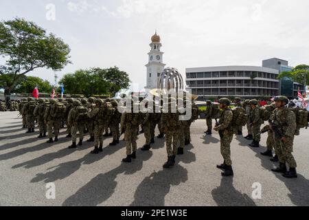 George Town, Penang, Malaysia - Aug 29 2022: Soldier stand at street during procession under sunny day Stock Photo