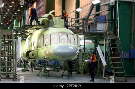 Ulan-Ude, Russia. 14th Mar, 2023. Workers on the assembly line inspect a Mi-171A2 civil passenger transport helicopter freshly out of the paint shop after being powder coated at the Ulan-Ude Aviation Plant, March 14, 2023 in Ulan-Ude, Buryatia, Russia. Credit: Mikhail Metzel/Kremlin Pool/Alamy Live News Stock Photo