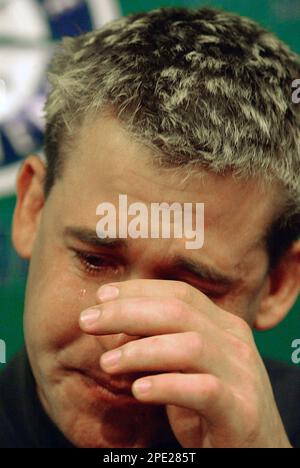 Former Seattle Mariners Bret Boone sheds tears during an interview