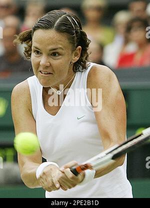 Venus Williams returns a shot to Lindsay Davenport during their match