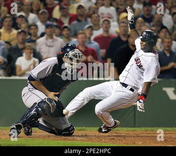 Boston Red Sox' Edgar Renteria, left, is greeted by teammate Manny