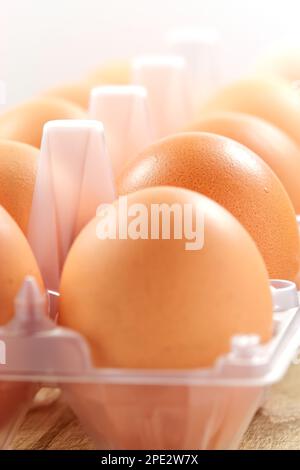 Detail close-up of chicken eggs in egg box Stock Photo