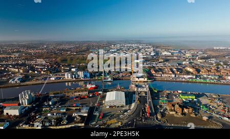 6th February 2023. Great Yarmouth, Norfolk.  Aerial view of construction of Yarmouth's 3rd River crossing from the east side.  Work was halted the very next day when a WWII unexploded bomb was dredge up on the far bank just left of new bridge structure.  The UXB was safely detonated in place a four days later after causing major disruption to local businesses and residents who had been evacuated. Stock Photo