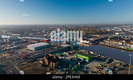 6th February 2023. Great Yarmouth, Norfolk.  Aerial view of construction of Yarmouth's 3rd River crossing from the east side.  Work was halted the very next day when a WWII unexploded bomb was dredge up on the far bank just left of new bridge structure.  The UXB was safely detonated in place a four days later after causing major disruption to local businesses and residents who had been evacuated. Stock Photo