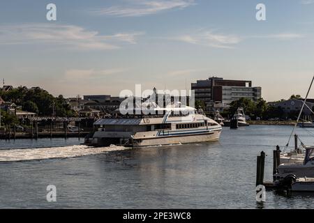 HHyannis Port, Massachusetts - July 8, 2022: Hy-Line high speed ferry leaves in Hyannis Port on a trip to Martha’s Vineyard Stock Photo
