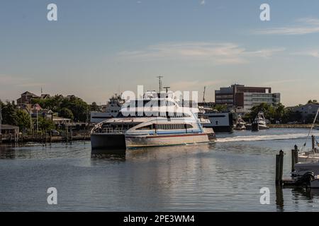 Hyannis Port, Massachusetts - July 8, 2022: Hy-Line high speed ferry arrives in Hyannis Port after a trip to Martha’s Vineyard with copy space. Stock Photo