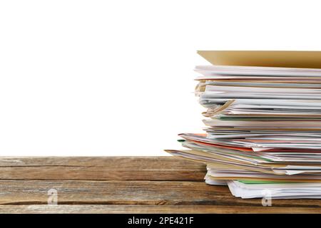 Stack of different files with documents on wooden table against white background. Space for text Stock Photo