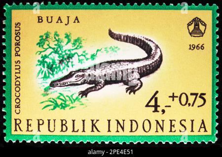 MOSCOW, RUSSIA - FEBRUARY 17, 2023: Postage stamp printed in Indonesia shows Saltwater Crocodile (Crocodylus porosus), Reptiles serie, circa 1966 Stock Photo