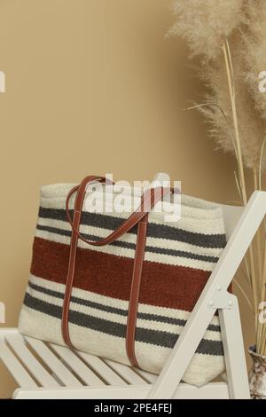 White Canvas Tote Bag on Rustic Wooden Wall Stock Photo - Alamy