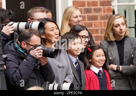 RETRANSMITTING AMENDING CAPTION Chancellor of the Exchequer Jeremy Hunt's wife Lucia Hunt and their children watch as he leaves 11 Downing Street, London, with his ministerial box, before delivering his Budget at the Houses of Parliament. Picture date: Wednesday March 15, 2023. See PA story POLITICS Budget. Photo credit should read: Stefan Rousseau/PA Wire
