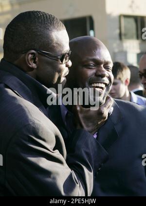 Dallas Cowboys former players Emmitt Smith, left, Troy Aikman, center rear  and Michael Irvin before a halftime ceremony during an NFL football game  against the New York Giants, Sunday, Sept. 20, 2009