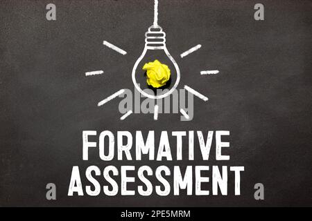Formative Assessment top view of text near white keyboard Stock Photo