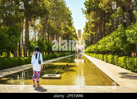 Female tourist visit famous sightseeing attraction in Dowlat Abad Garden , Yazd , Iran Stock Photo