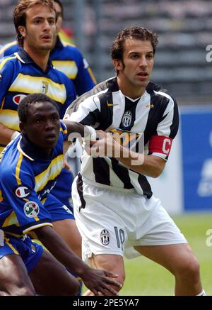 Juventus striker Alessandro Del Piero, center, followed by teammate Giorgio  Chiellini, left, with other teammates, warms-up next to an Italian Serie B  second division sign, at bottom, before the start of the