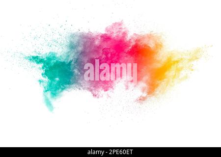 Yellow red and green dust explosion on white background. Red yellow  and green powder splash. Stock Photo