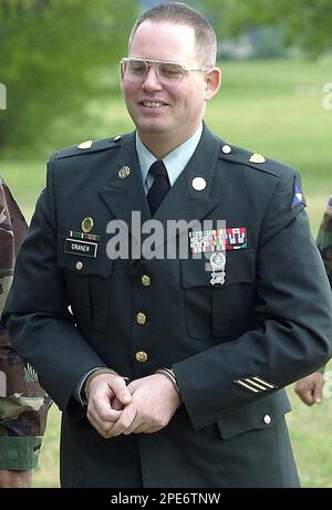 Army Pvt. Charles Graner is led out the back door of the judicial ...