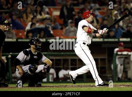 Washington, D.C. - April 3, 2005 -- Washington Nationals Ryan Church,  right, is congratulated by teammates Brad Wilkerson, center, and Vinny  Castilla, left, after hitting a three-run home run in the second