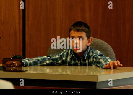 Christian Caruso 9 listens to a question posed by District