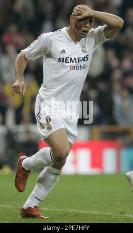 Real Madrid's Brazilian player Ronaldo celebrates after scoring