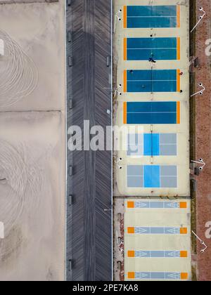 An aerial top view over an empty park with different ball courts for sports and playground areas Stock Photo