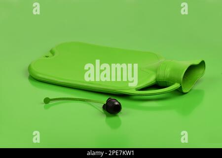 Green rubber heating pad isolated on a green background. Extreme closeup. High resolution photo. Full depth of field. Stock Photo
