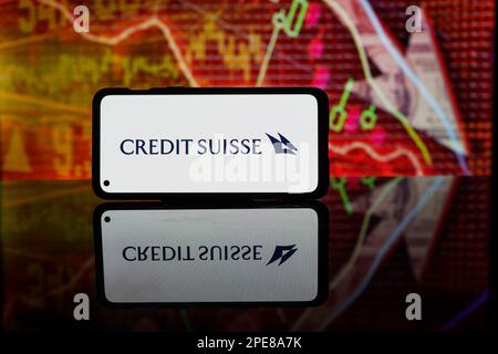 Credit suisse bank logo on screen in red background. American Bank collapse and bankrupt. Economical crysis. High quality photo Stock Photo