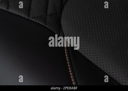 Part of leather car seat. Macro. Сar leather interior details. High angle view of modern car fabric seats. Stock Photo