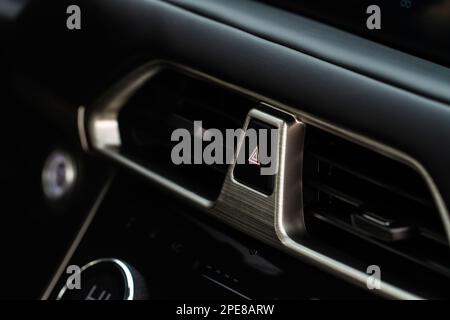 Warning button in a car. Car emergency stop button. Stock Photo