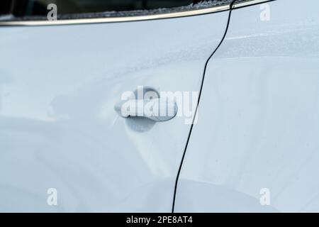 Close up of car door handle. Keyless entry system with touch sensor. Car remote control by smart key. Modern white car Stock Photo