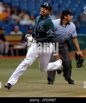 The Tampa Bay Devil Rays Carl Crawford is tagged out at home in
