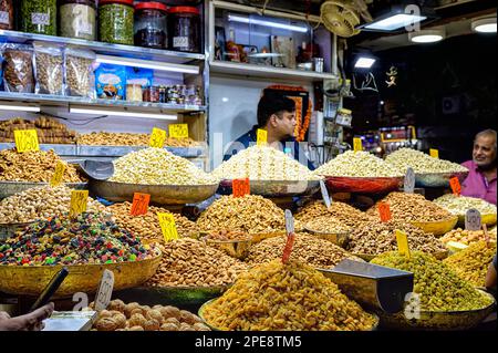 Nuts, dried fruits and many different spices on sale in the spice market along Khari Baoli road in Old Delhi Stock Photo