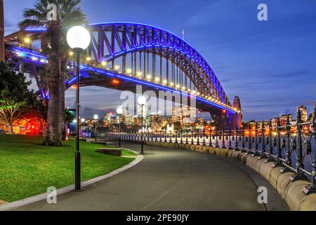 Sunset over Harbour Bridge in Sydney, Australia brightly illuminated during Vivid 2022 light festival. Stock Photo