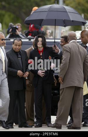 Pop star Michael Jackson, center, arrives at the Santa