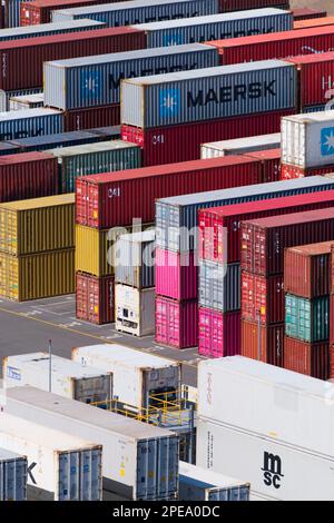 Metal shipping containers in port stacked in lines at Lyttelton Port, Christchurch, New Zealand. Stock Photo