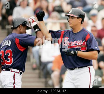 Atlanta Braves outfielder Brian Jordan, right, celebrates with his