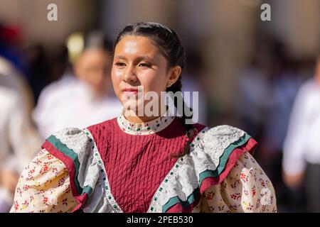 Matamoros, Tamaulipas, Mexico - November 26, 2022: The Desfile del 20 de Noviembre, Dancer wearing traditional clothing performing at the parade Stock Photo