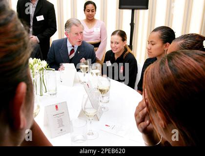 Britain's Prince Charles, sitting left, speaks to young people who have participated in the Prince's Trust courses during a function for the Trust, in Auckland, Wednesday, March 9, 2005. Prince Charles is on a six day visit to New Zealand. (AP Photo/William West, Pool)