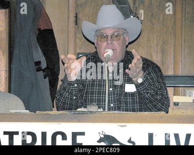 Dennis Henrichs of Beatrice Neb. conducts an auction at