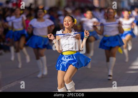 Matamoros, Tamaulipas, Mexico - November 26, 2022: The Desfile del 20 de Noviembre, Cheerleader team performing at the parade Stock Photo