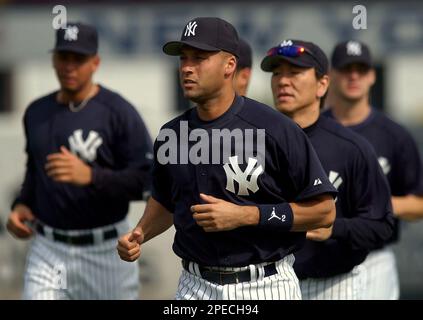 New York Yankees team captain Derek Jeter wipes a tear from his eye before  speaking from home plate in honor of legendary Yankees owner George  Steinbrenner and long time Yankees announcer Bob