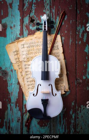 White Violin Hanging On Old Wood Wall Stock Photo