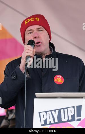 London, UK. 15th March, 2023. Mark Serwotka, General Secretary of the Public Commercial Services Union (PCS) speaks at the Save Our Schools rally. Thousands of striking teachers, joined by university staff, civil servants, junior doctors, and other workers taking undustrial action marched through central London, concluding with a rally in Trafalgar Square. Members of the National Education Union are striking for an above-inflation payrise and improved working conditions, with teachers being amongst 700,000 workers walking out today.  Credit: Eleventh hour Photography/Alamy Live News Stock Photo